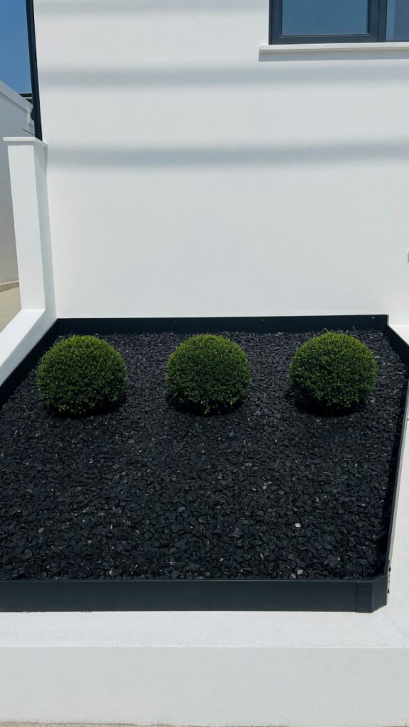 5 a minimal modern front garden bed photographed in 